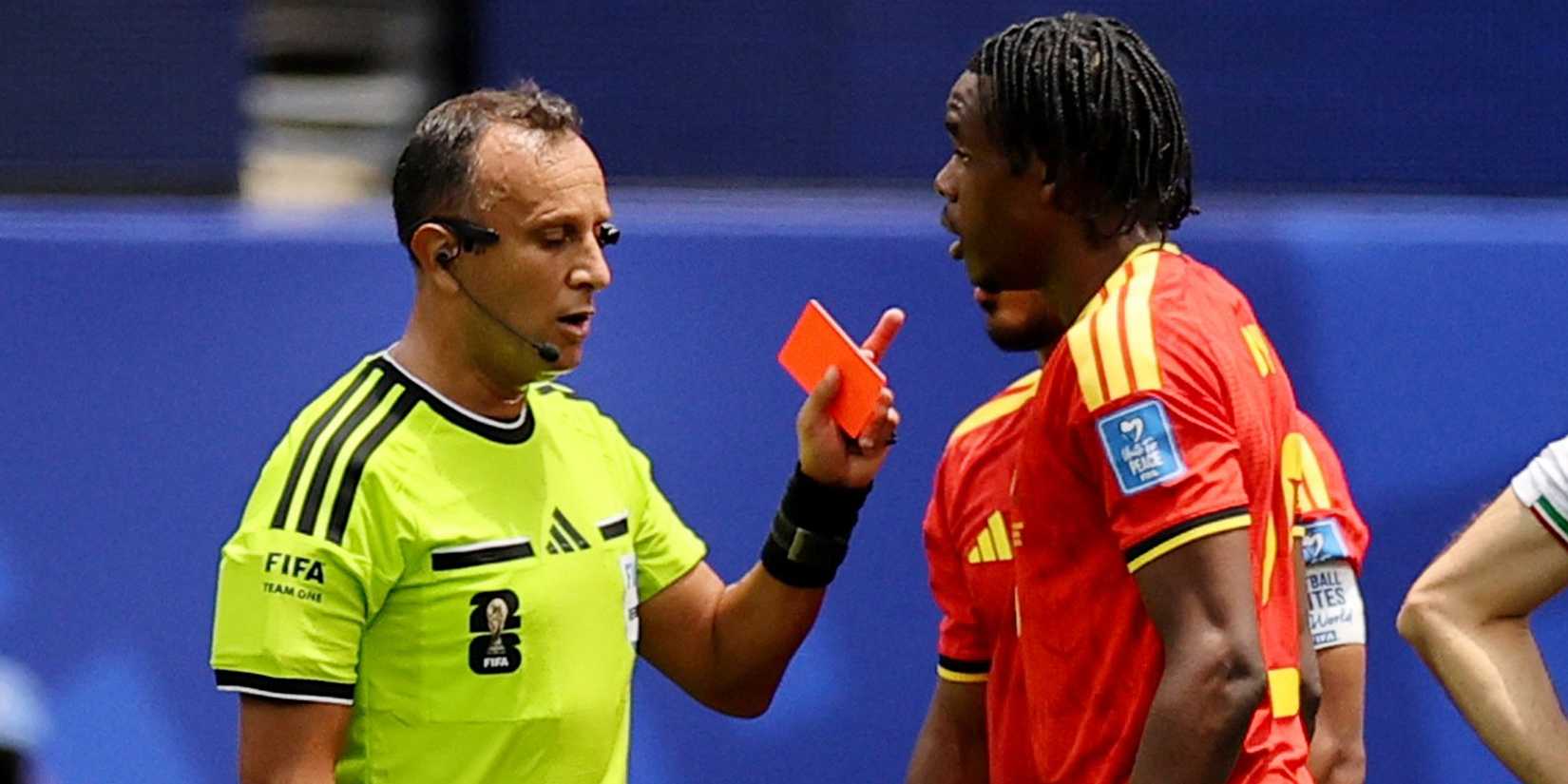Nathan Ngoy is shown a red card in the World Cup game between Belgium and Iran