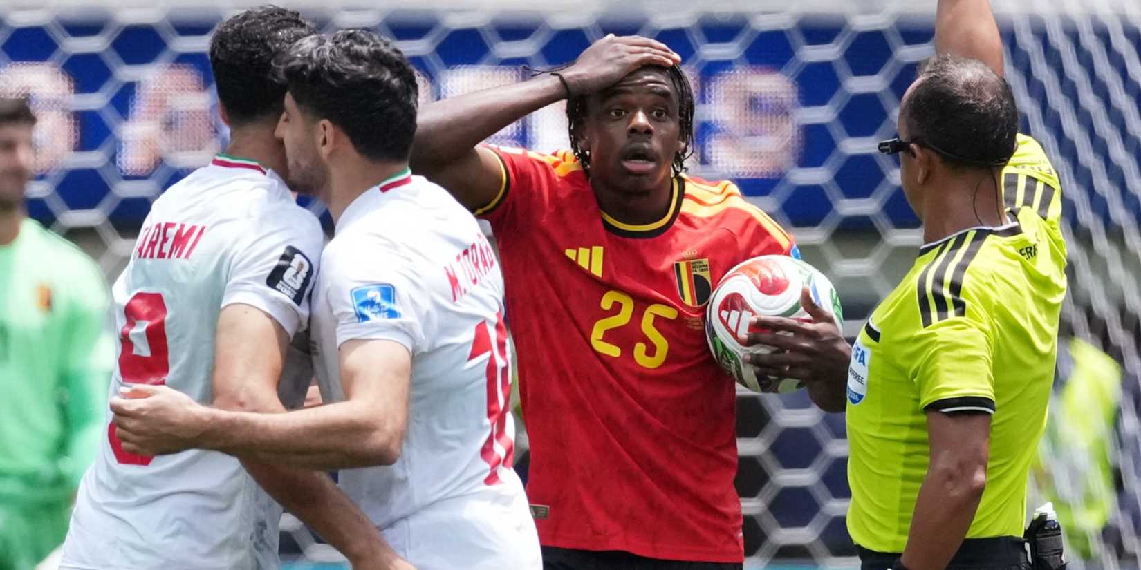 Nathan Ngoy is shown a red card in the World Cup game between Belgium and Iran