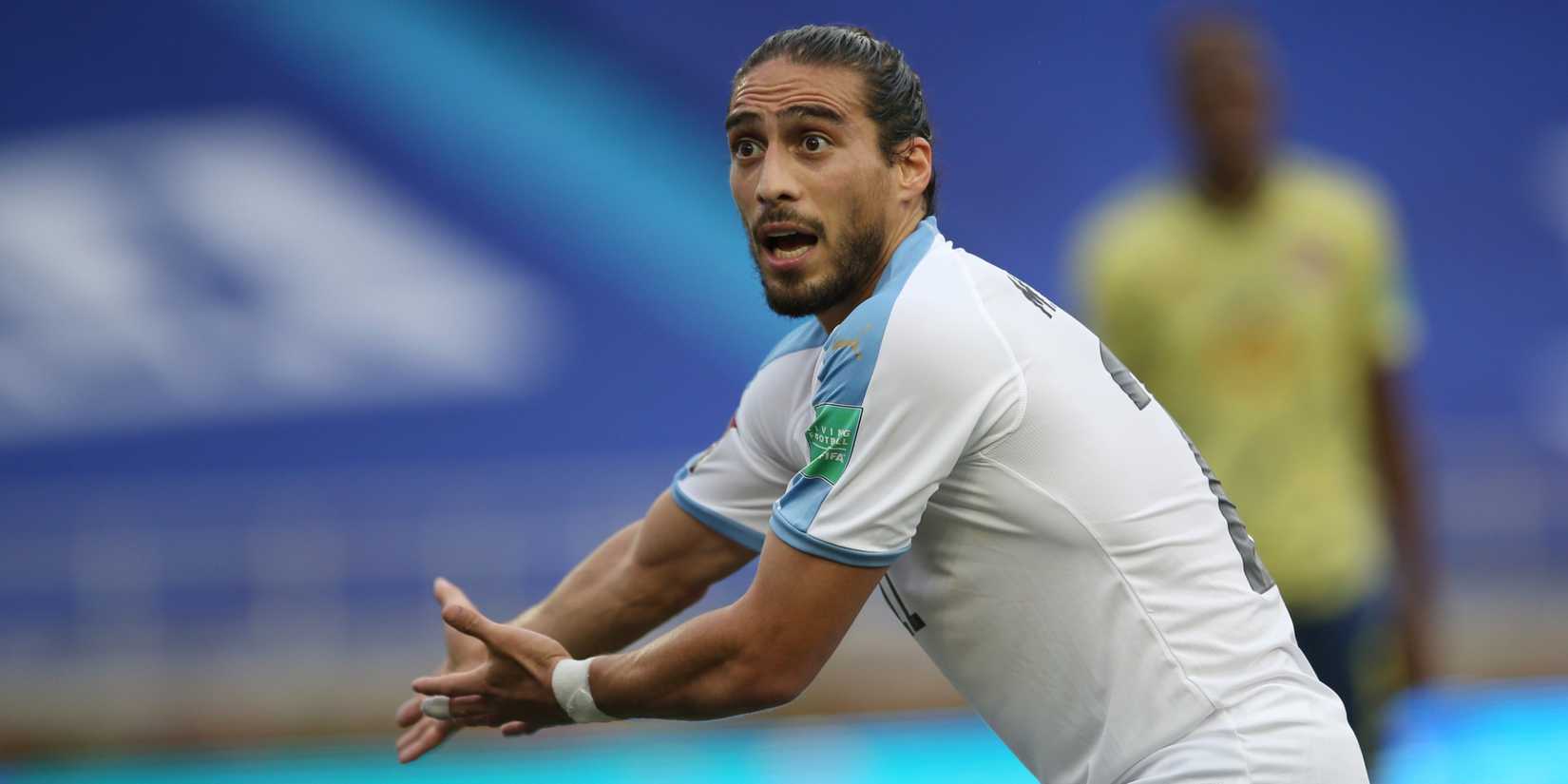 Martin Caceres representing Uruguay