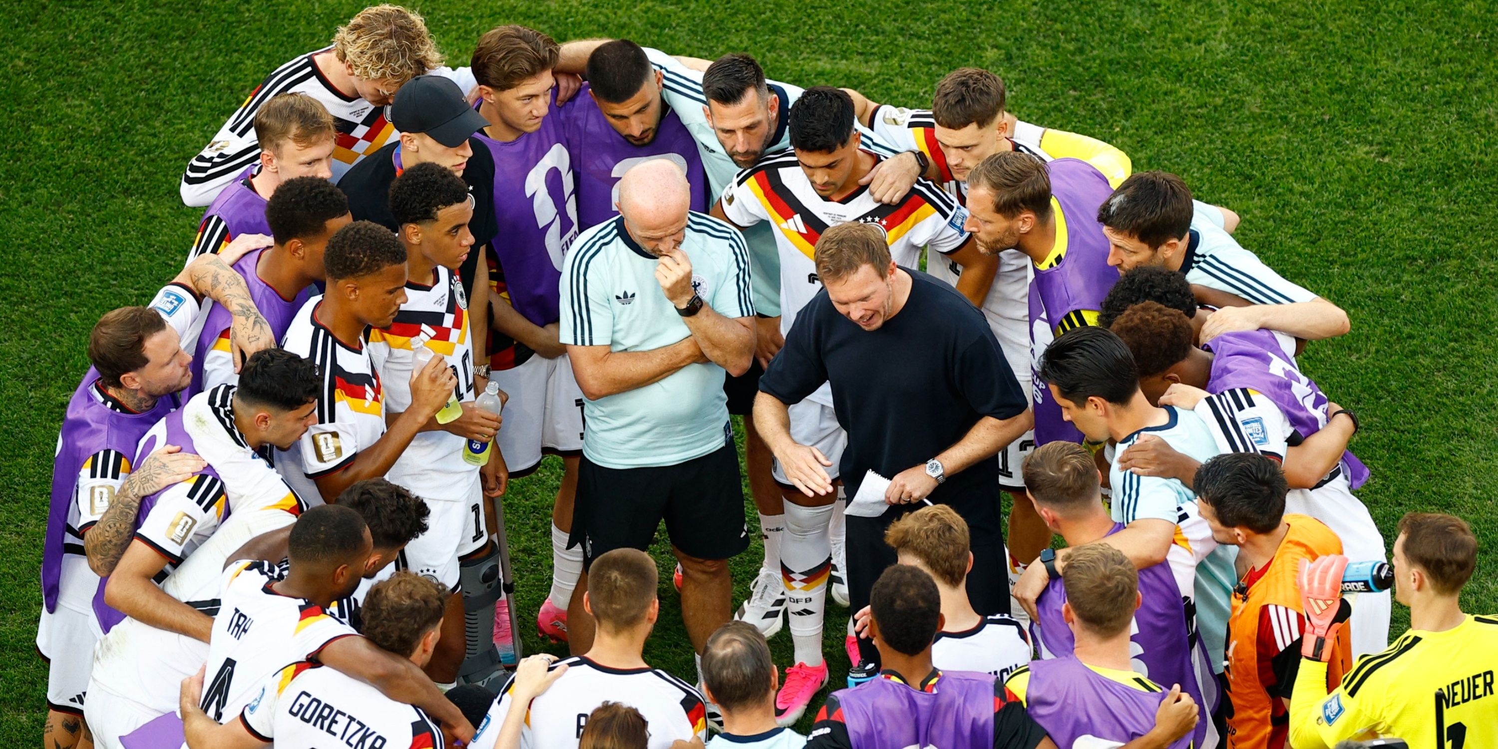 Julian Nagelsmann talks to his Germany players ahead of their penalty shootout vs Paraguay