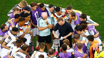 Julian Nagelsmann talks to his Germany players ahead of their penalty shootout vs Paraguay