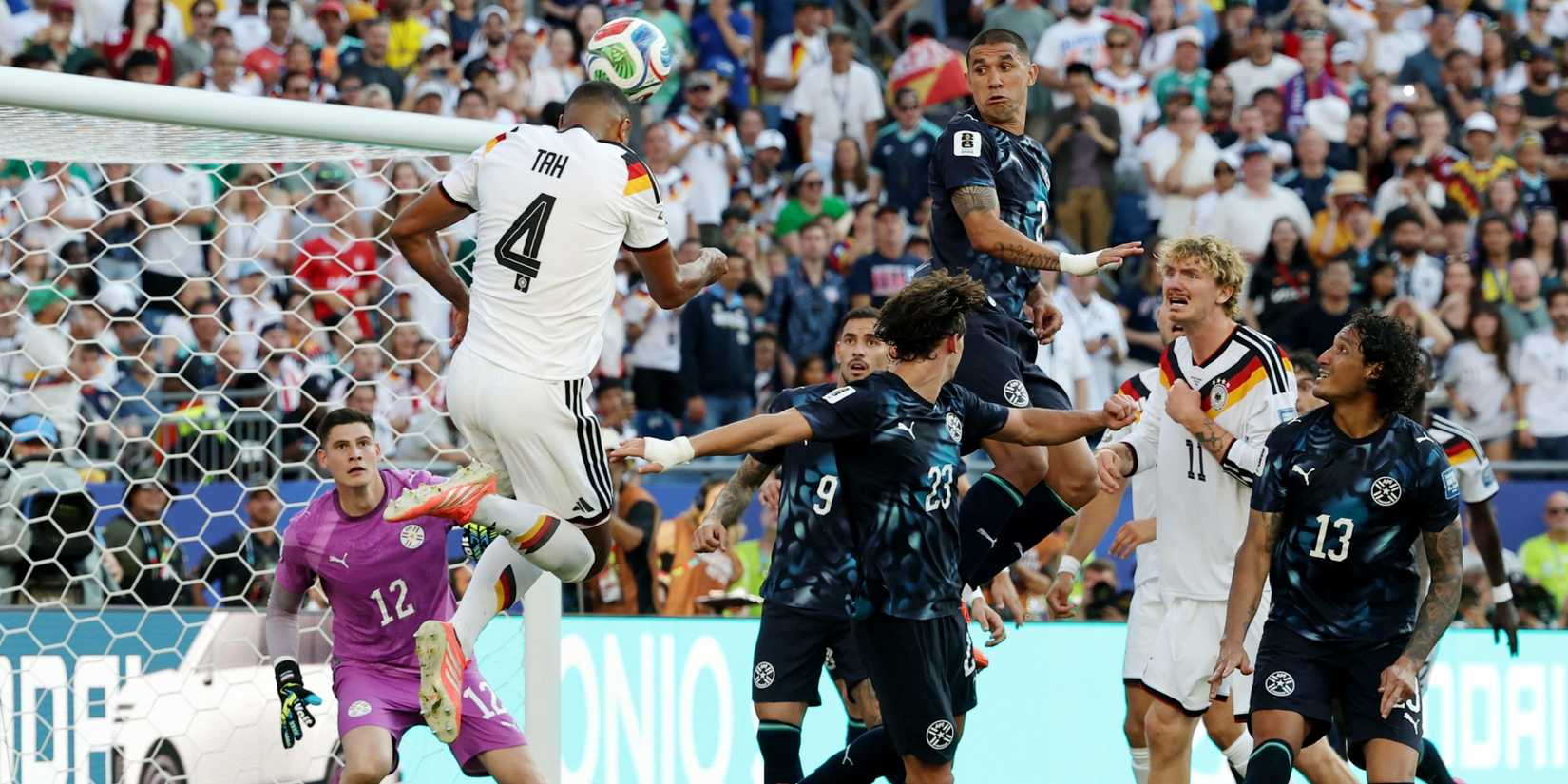 Germany's Jonathan Tah heads home vs Paraguay
