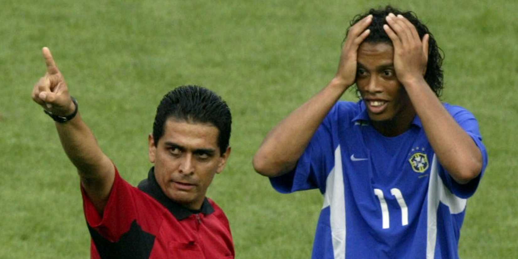 Brazil's Ronaldinho reacts as referee Felipe Ramos Rizo shows him a red card, World Cup 2002