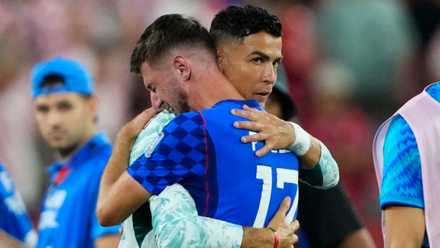 Cristiano Ronaldo consoles Petar Sucic after Portugal 2-1 Croatia