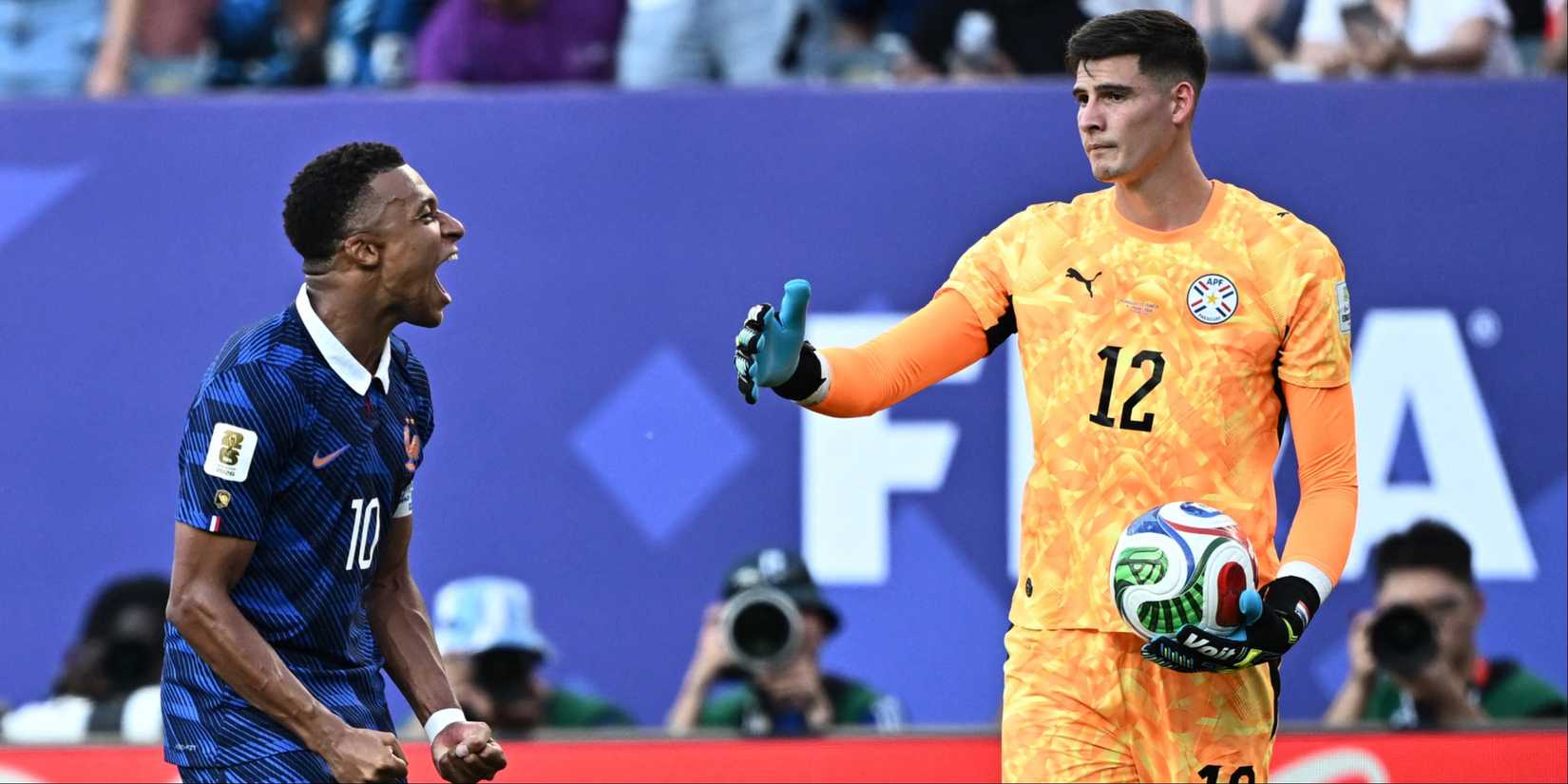 Kylian Mbappe (France) and Orlando Gill (Paraguay)