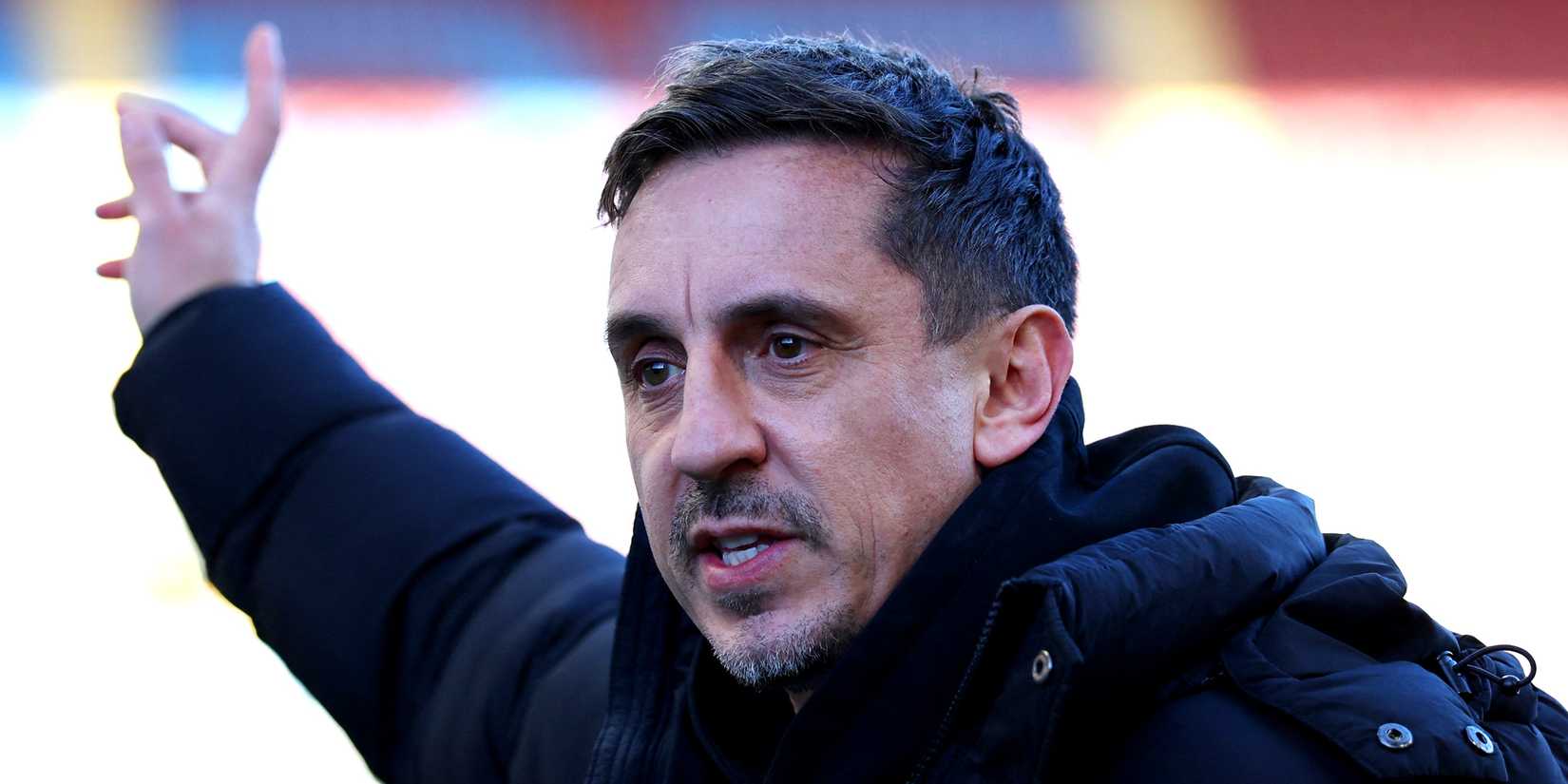 TV pundit Gary Neville points at a game