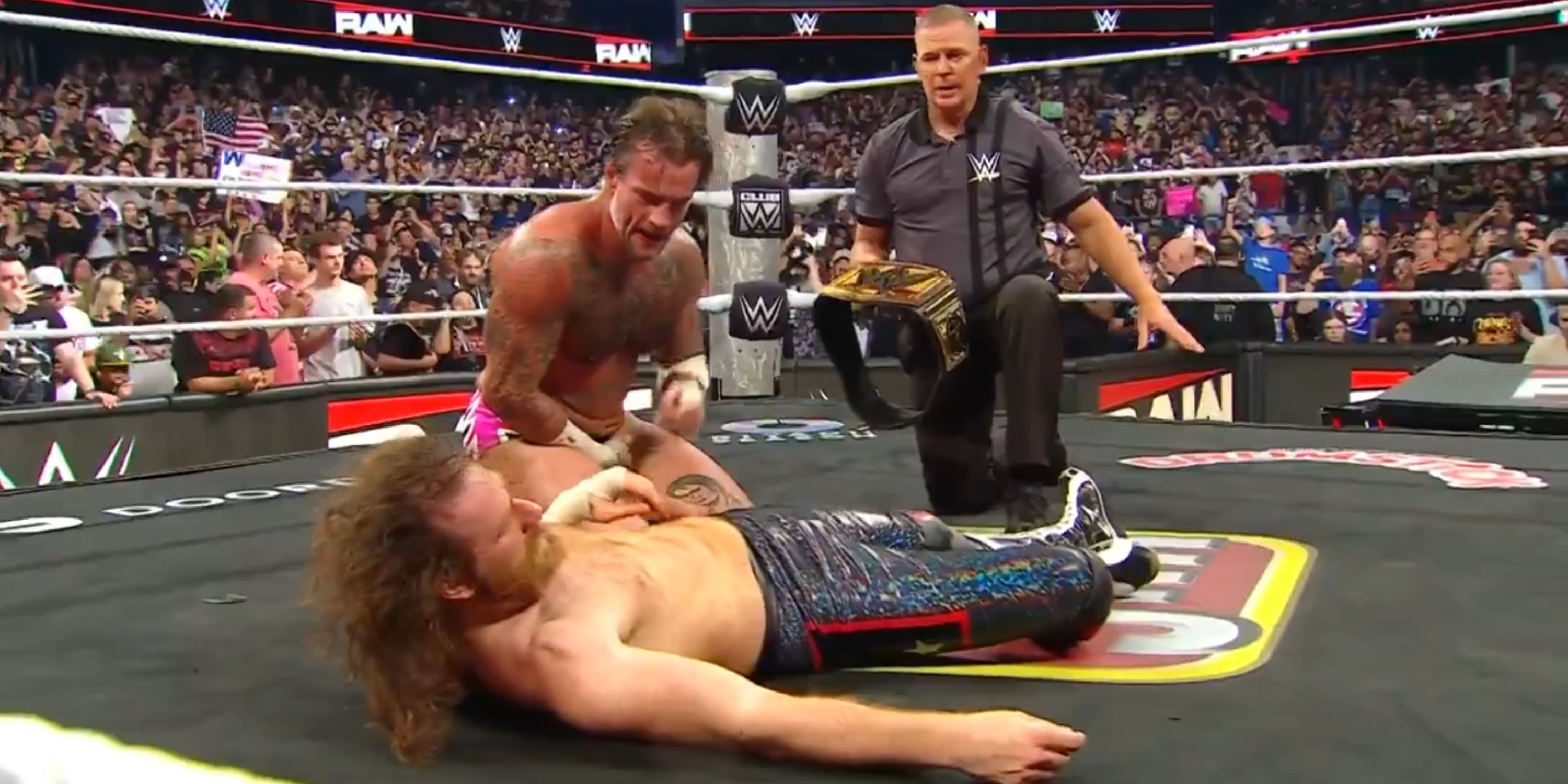 CM Punk beating Sami Zayn on WWE Raw