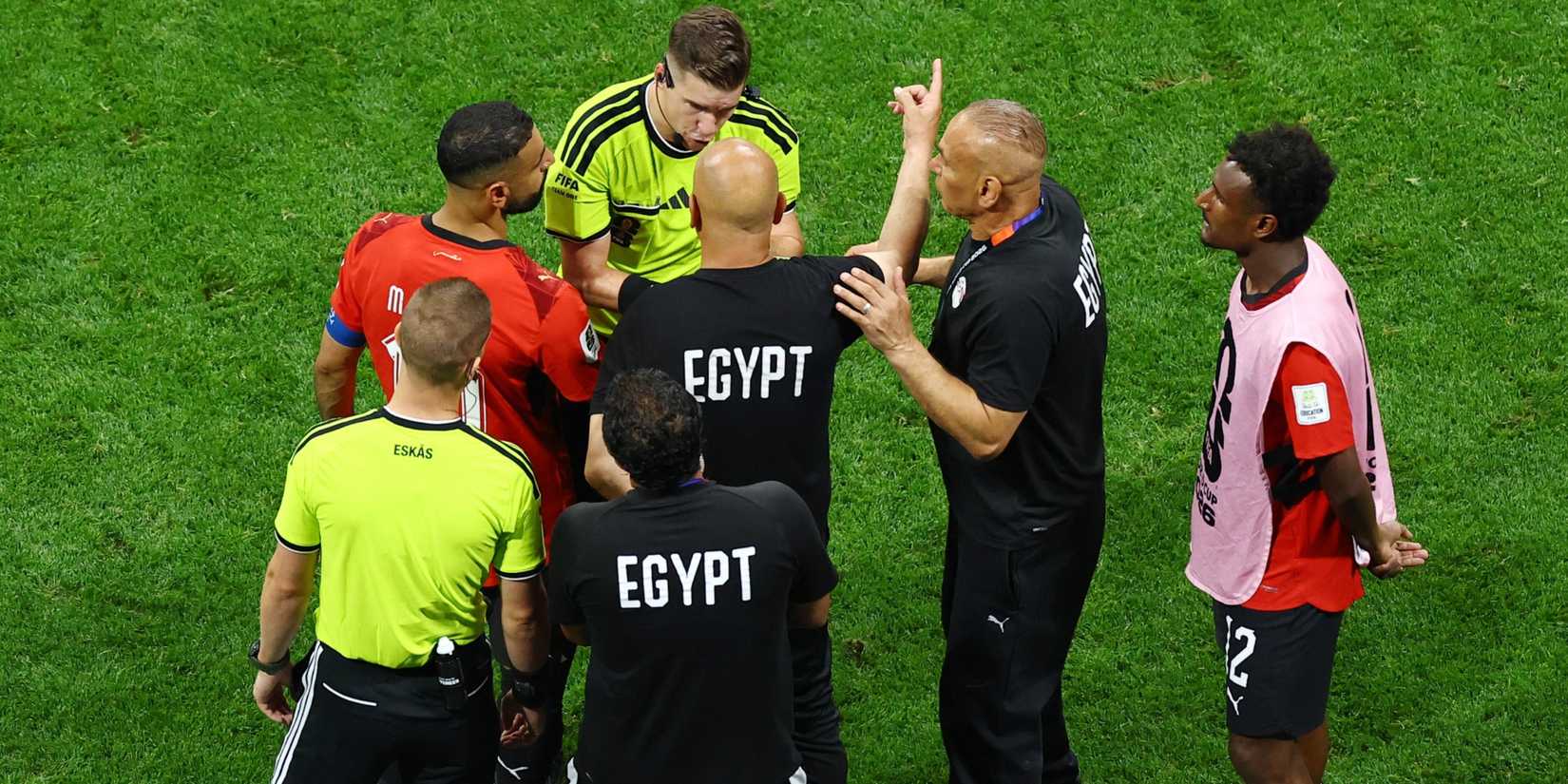 Egypt coaches argue with the referee after Argentina's winner