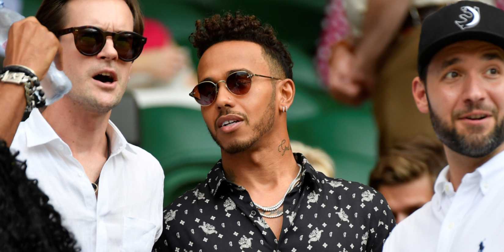 Alexis Ohanian and Lewis Hamilton arrive for Serena Williams of the U.S.' final against Germany's Angelique Kerber