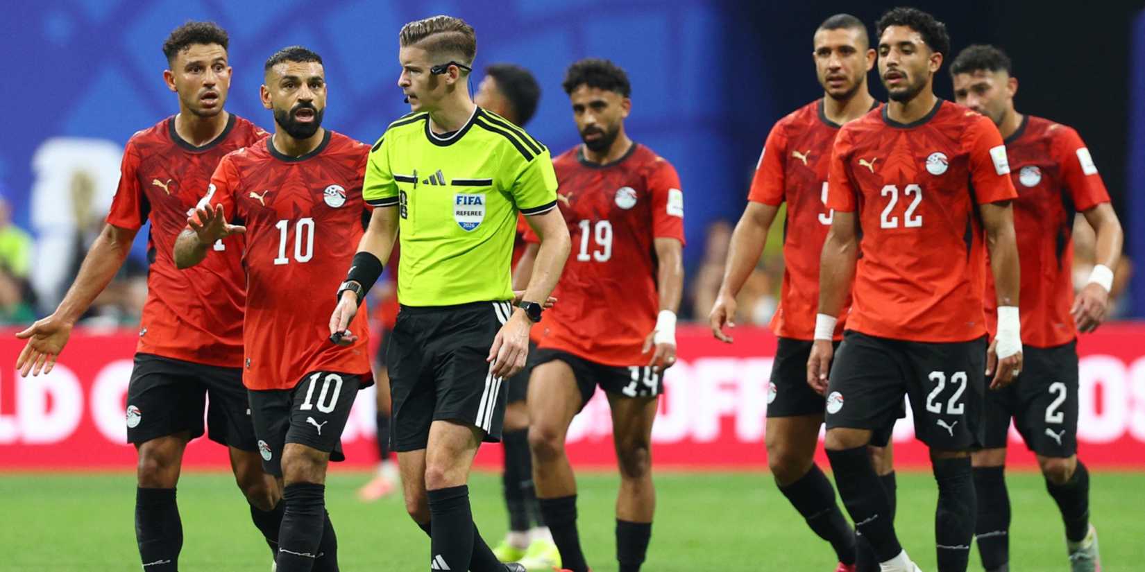 Egypt's Mohamed Salah remonstrates with referee Francois Letexier after Argentina's Enzo Fernandez scores their third goal