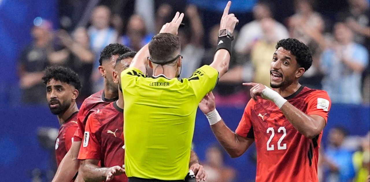 Egypt's Omar Marmoush remonstrates with referee Francois Letexier after Argentina's Enzo Fernandez scores their third goal