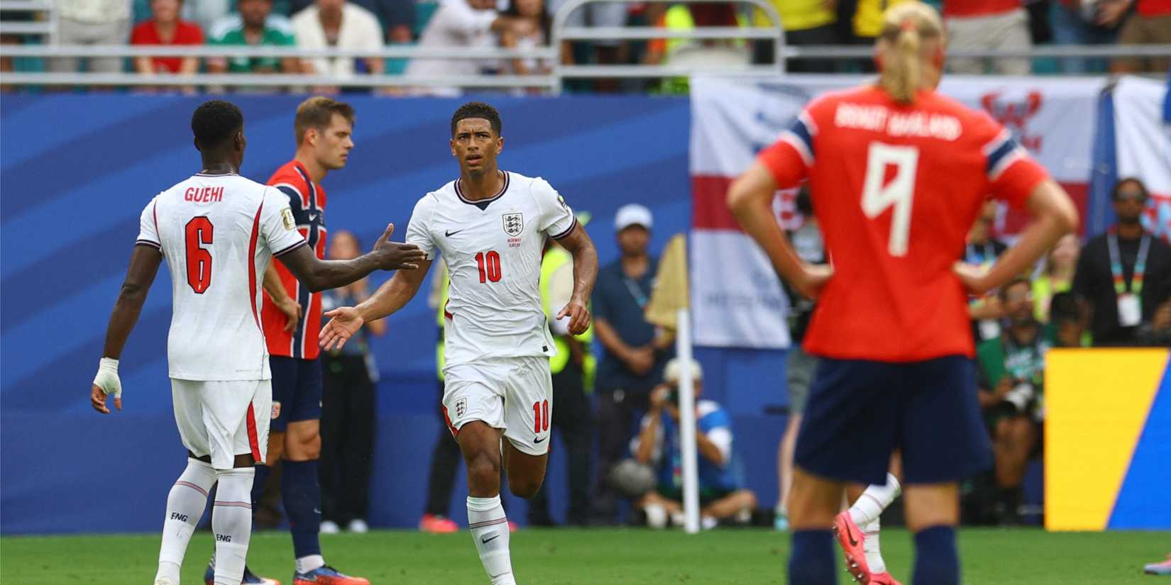 England's Jude Bellingham celebrates scoring their first goal with Marc Guehi