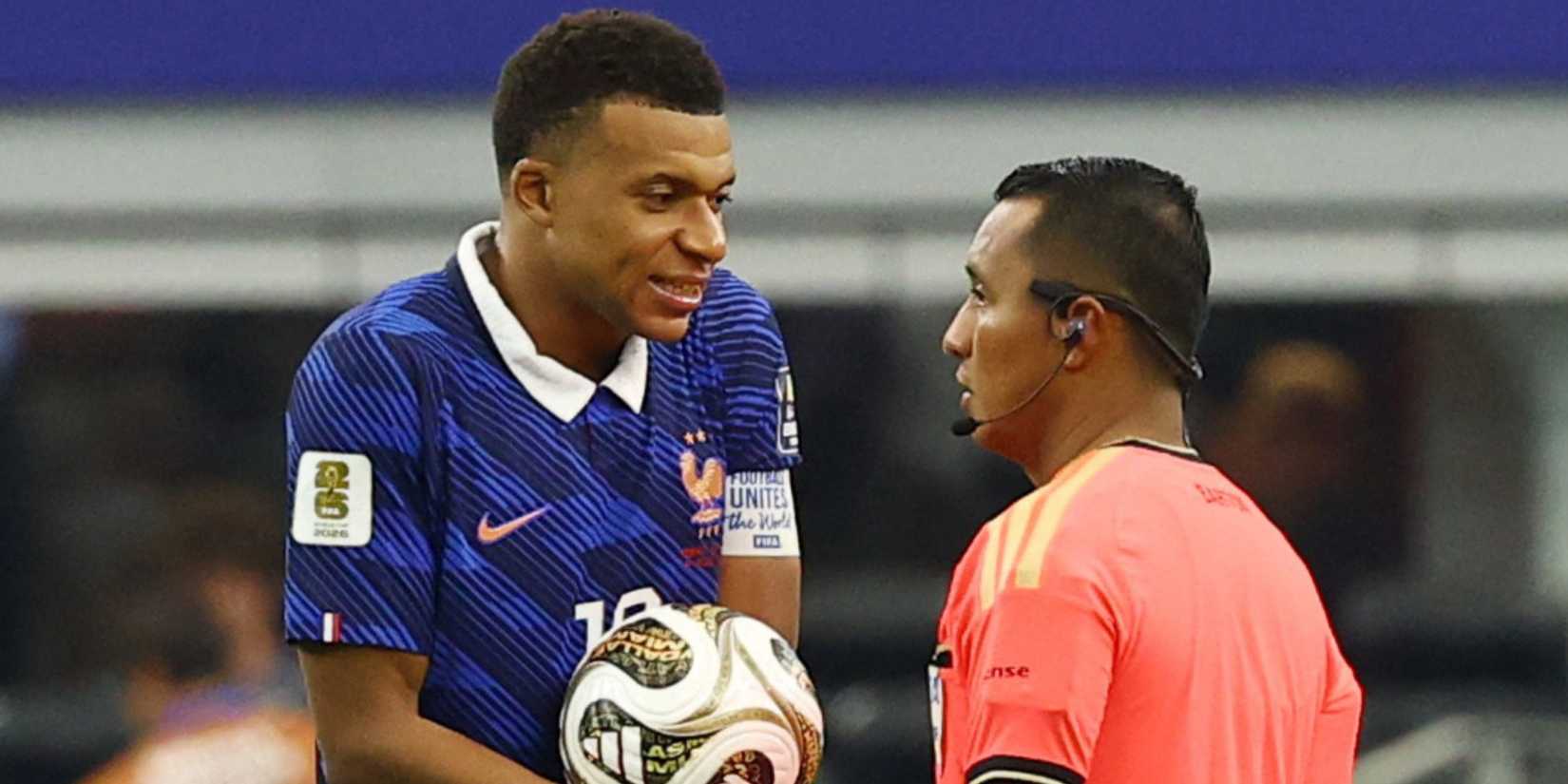 Kylian Mbappe and referee
