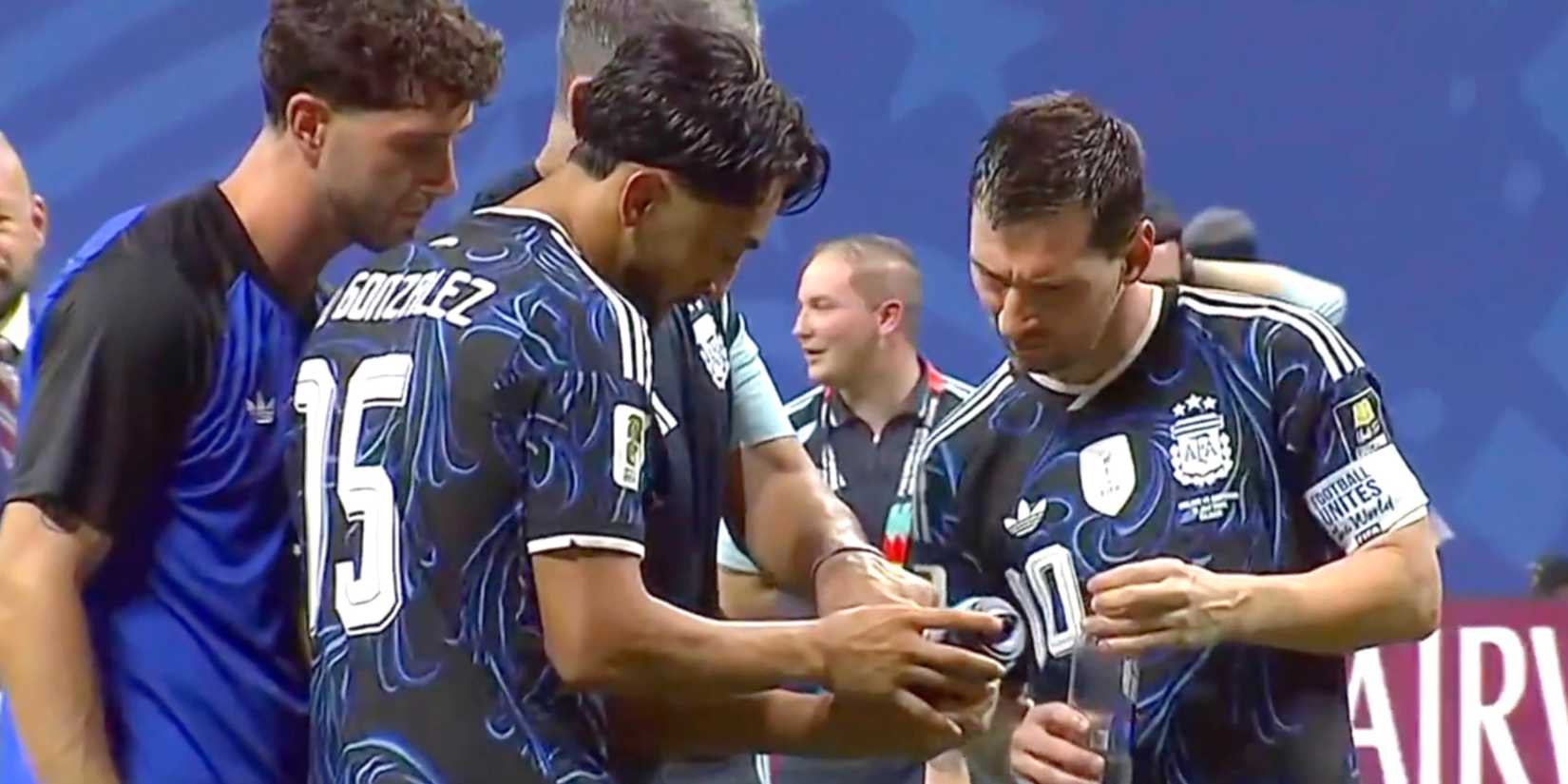 Lionel Messi and Argentina players react after finding Jordan Pickford's water bottle at full-time