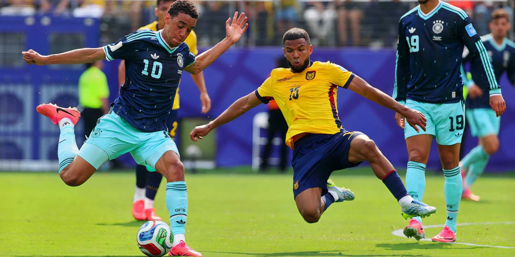 Jamal Musiala is tackled by Pedro Vite