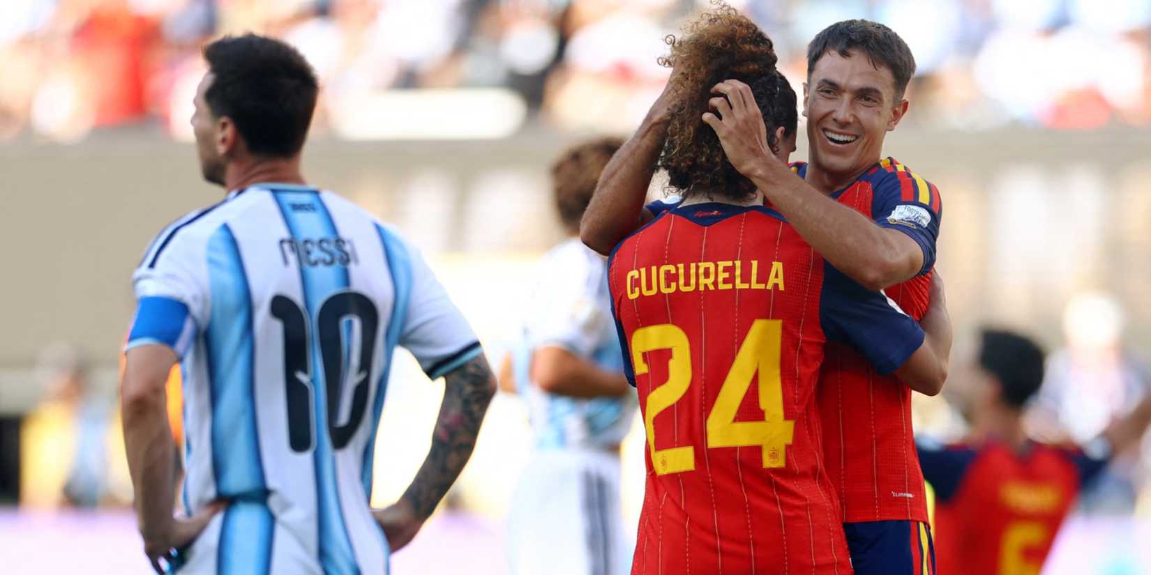 Spain's Martin Zubimendi and Marc Cucurella celebrate winning the World Cup as Argentina's Lionel Messi looks dejected