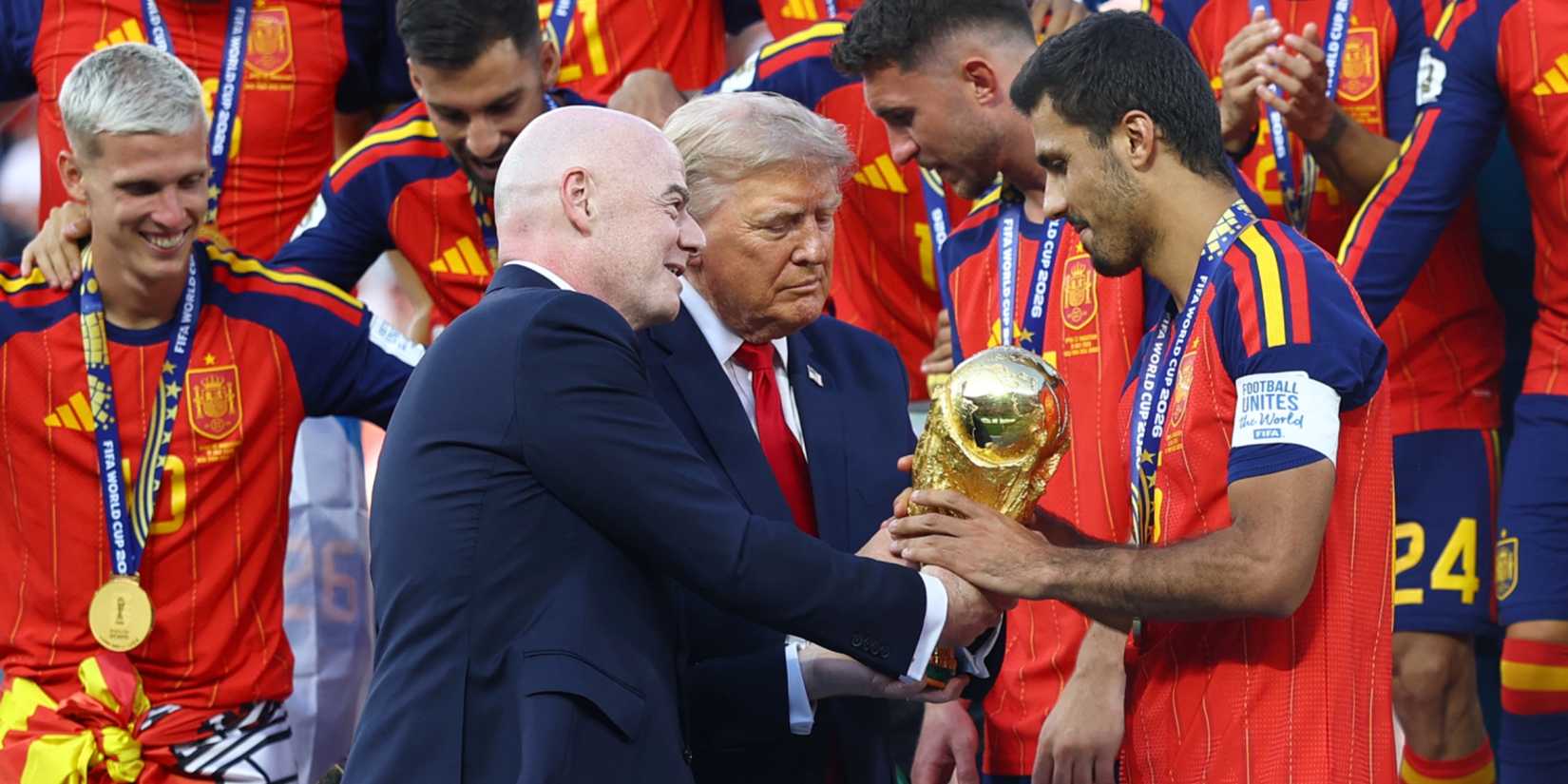 U.S. President Donald Trump and FIFA President Gianni Infantino hands the World Cup trophy to Spain's Rodri ahead of the trophy lift