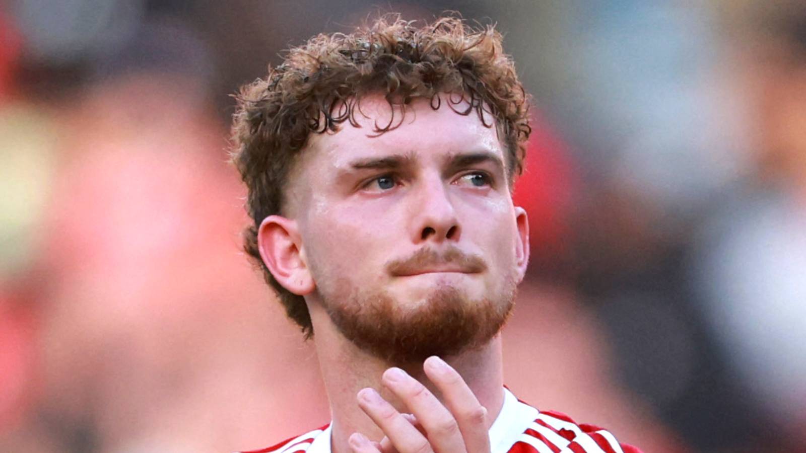 Liverpool's Harvey Elliott applauds fans after a friendly match