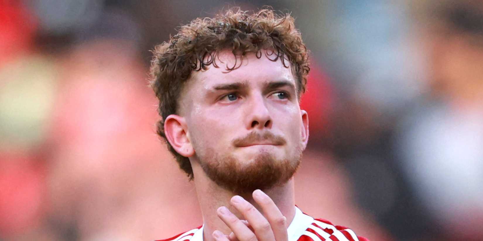 Liverpool's Harvey Elliott applauds fans after a friendly match