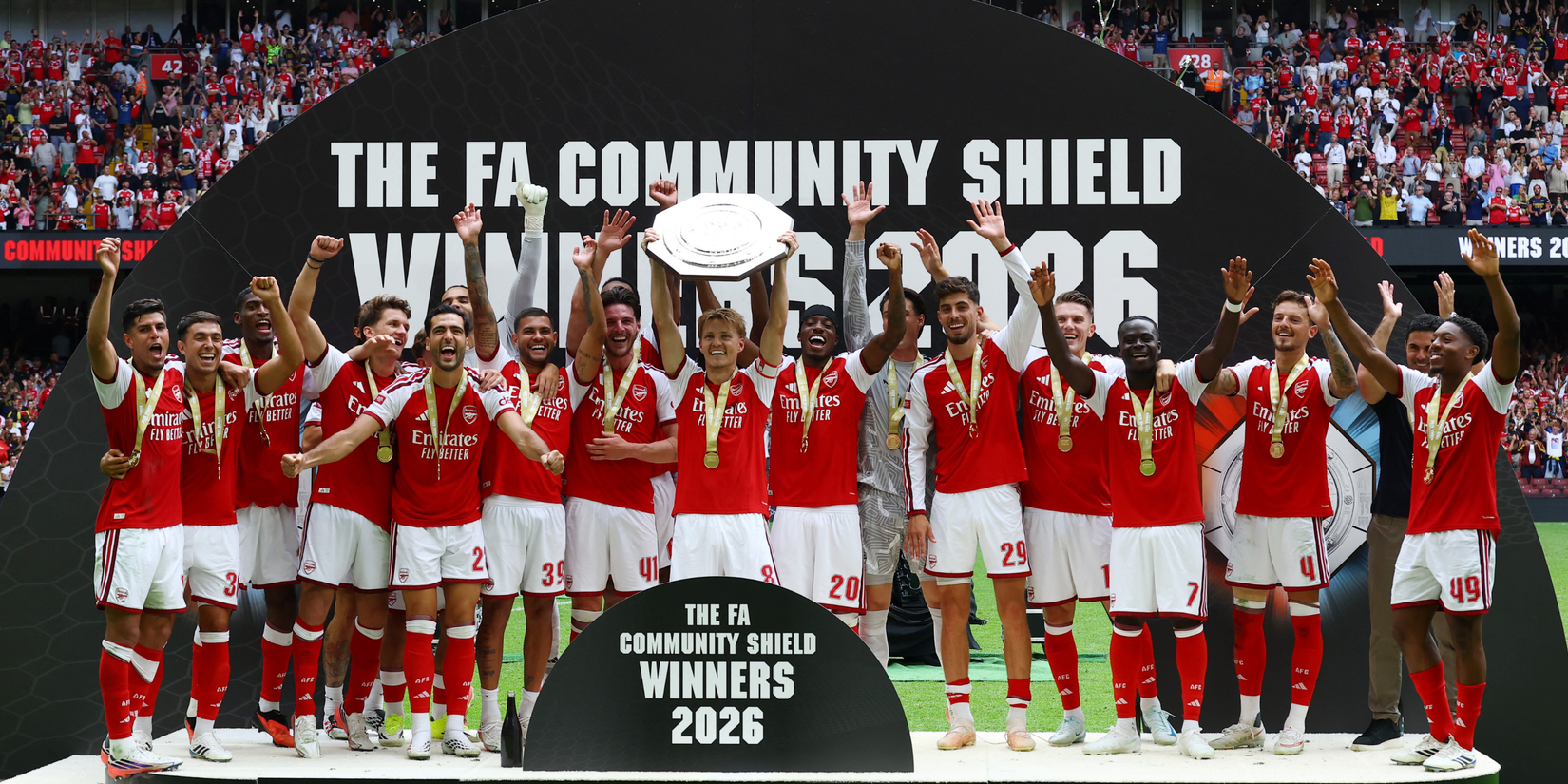 Arsenal's Martin Odegaard lifts the trophy as he celebrates with teammates after winning the FA Community Shield