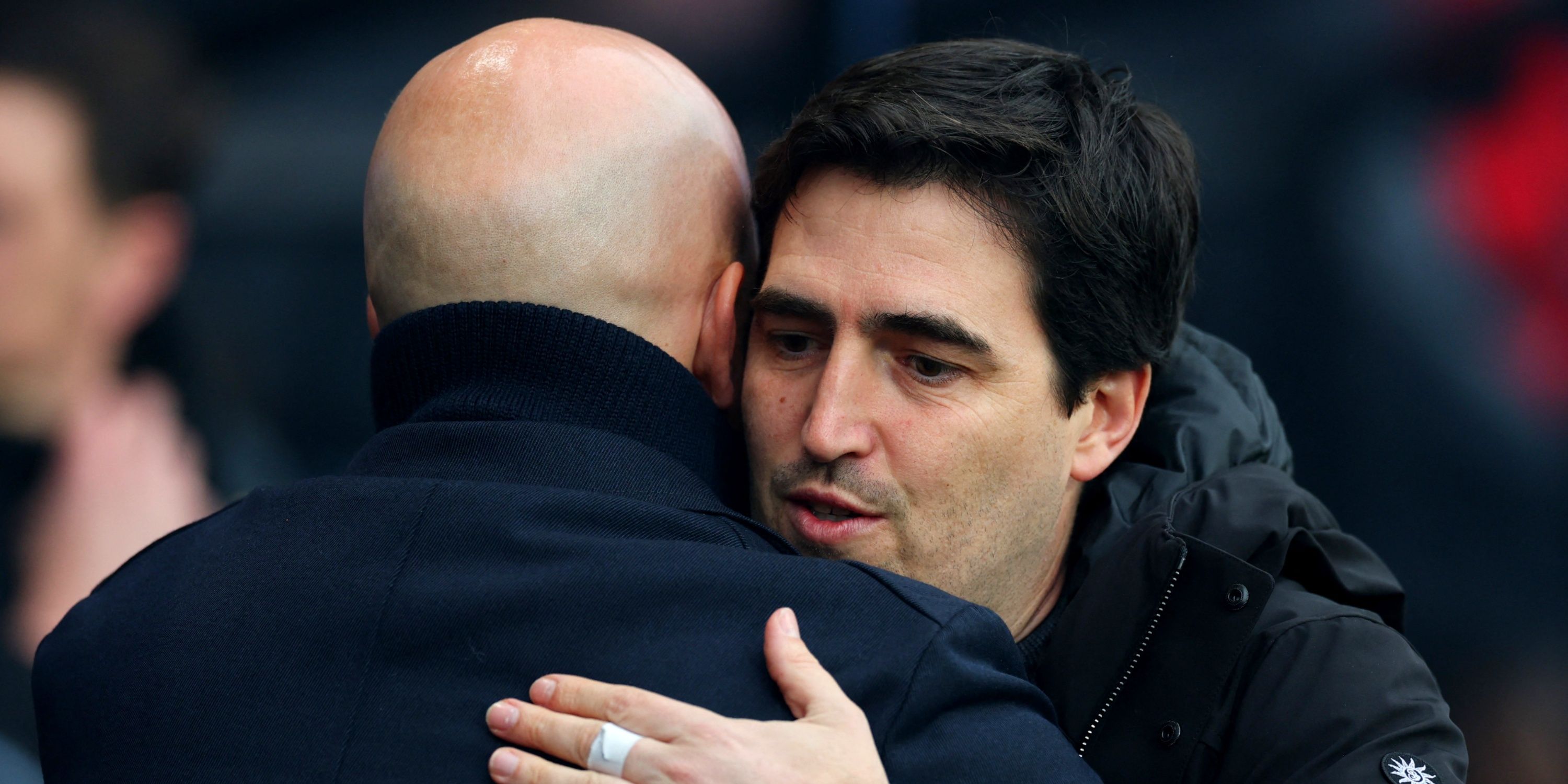 Ex-Liverpool manager Arne Slot hugs then-Bournemouth manager Andoni Iraola