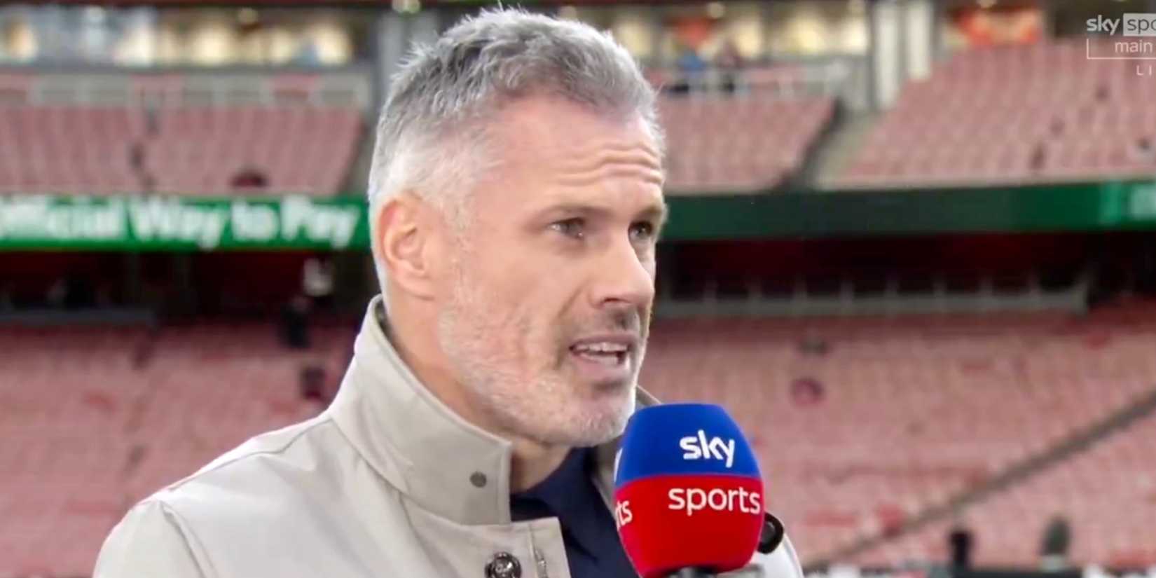 Jamie Carragher talking into a Sky Sports Microphone