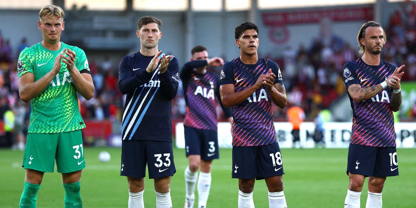 Tottenham Hotspur's Antonin Kinsky, Ben Davies, Mateus Fernandes and James Maddison look dejected as they applaud fans after the match