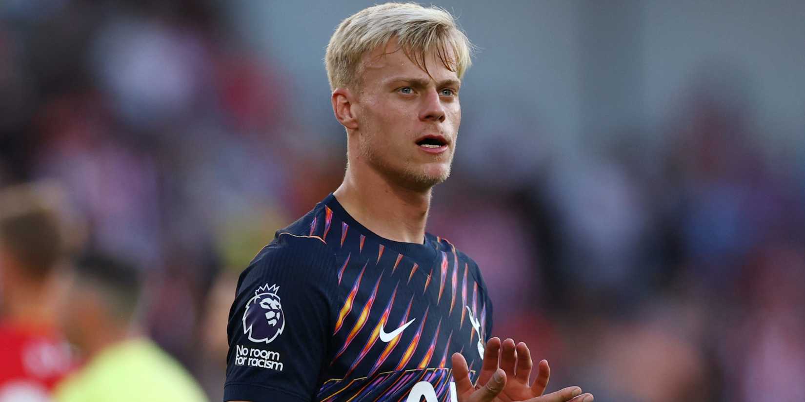 Tottenham defender Jan Paul van Hecke applauds the fans