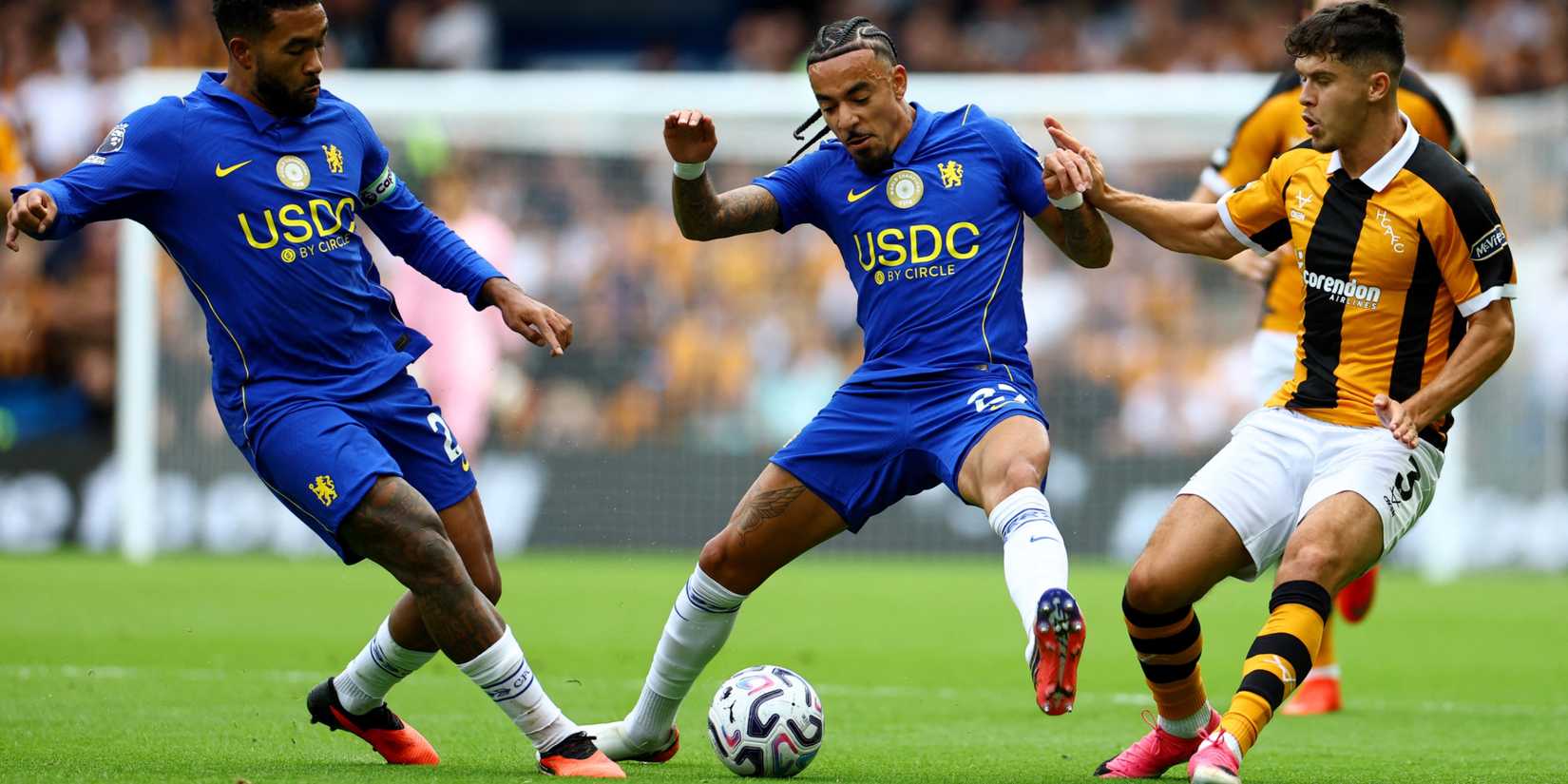 Chelsea's Reece James and Malo Gusto in action with Hull City's Ryan Giles