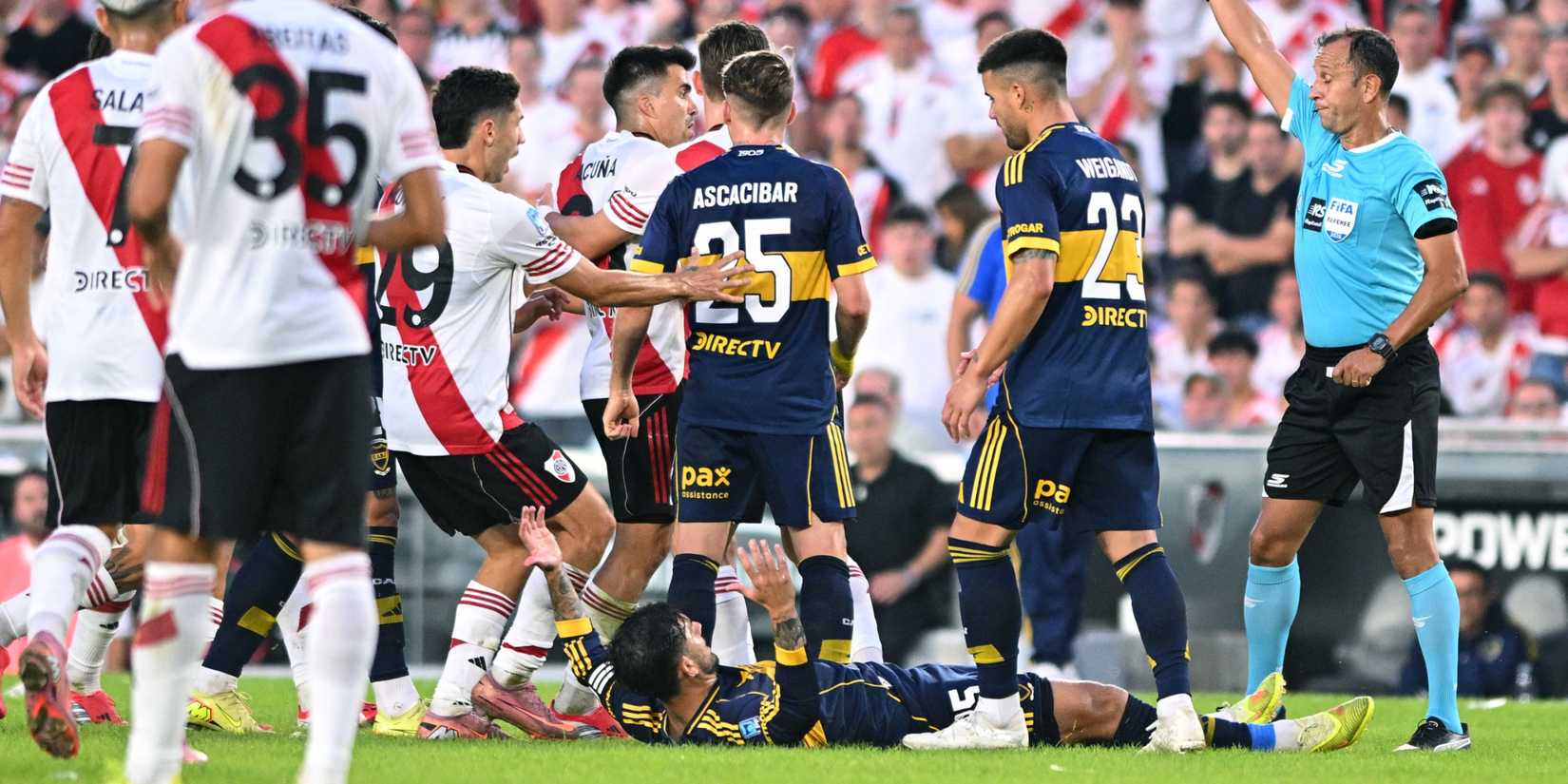 Boca Juniors and River Plate players clash