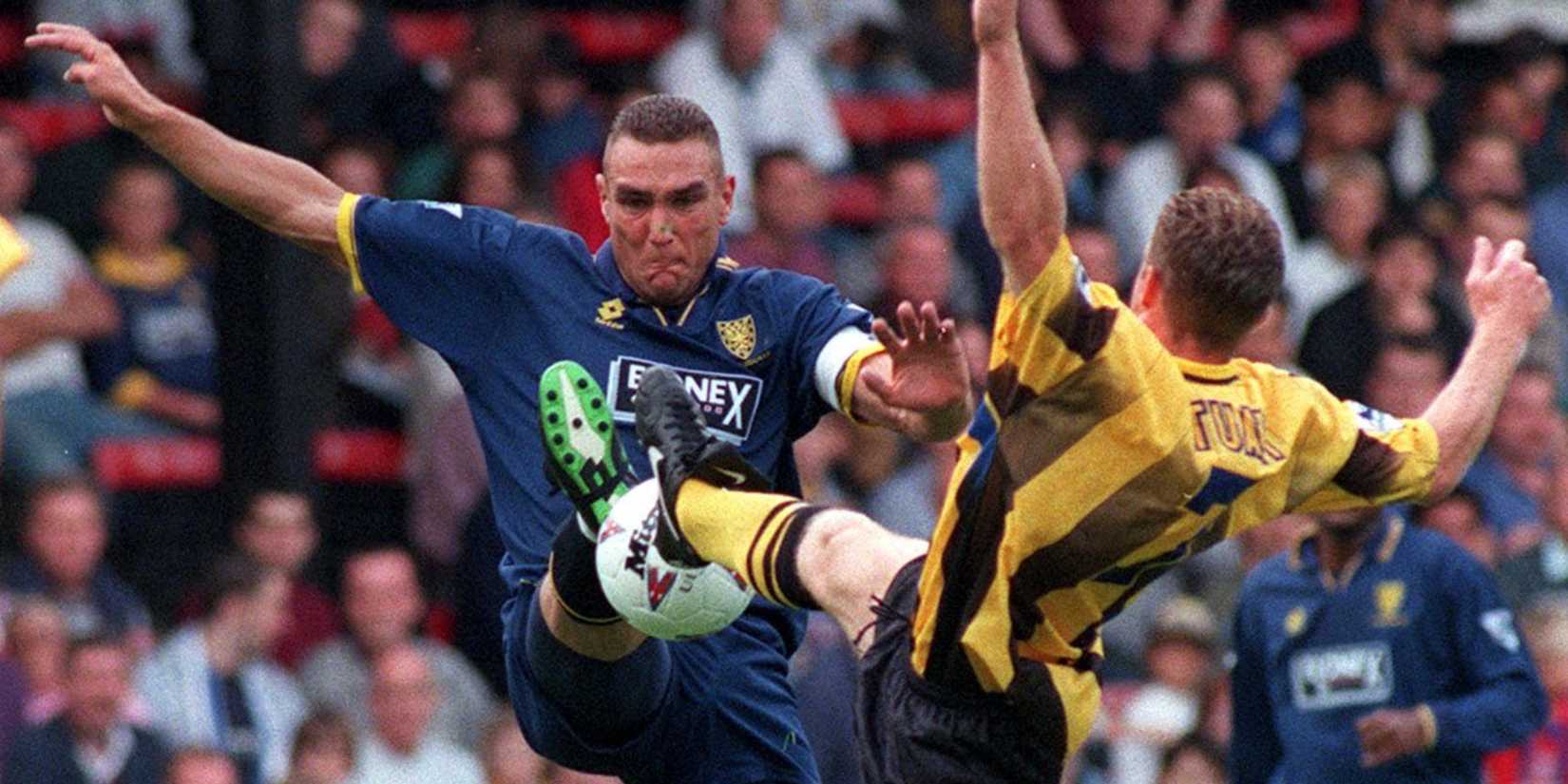 Wimbledon's Vinnie Jones battles for the ball with Everton's Graham Stuart