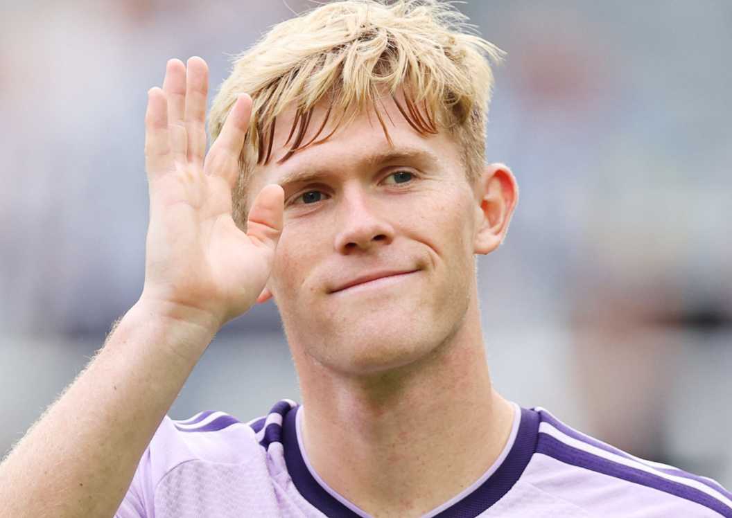 Newcastle United defender Lewis Hall waves to the crowd