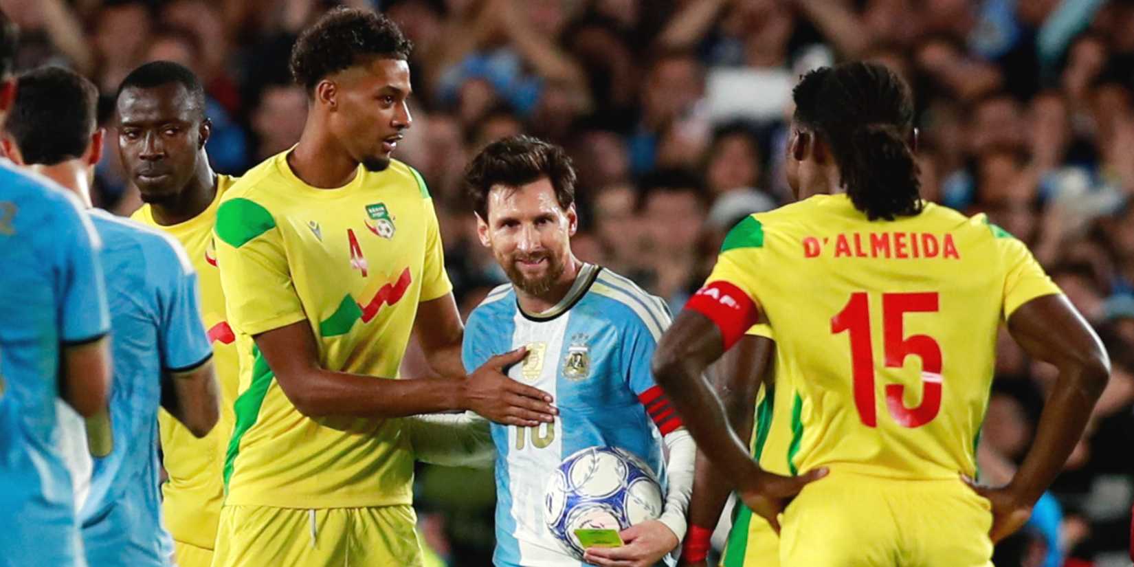 Argentina's Lionel Messi with Benin's Amiro Amadou after his final international match