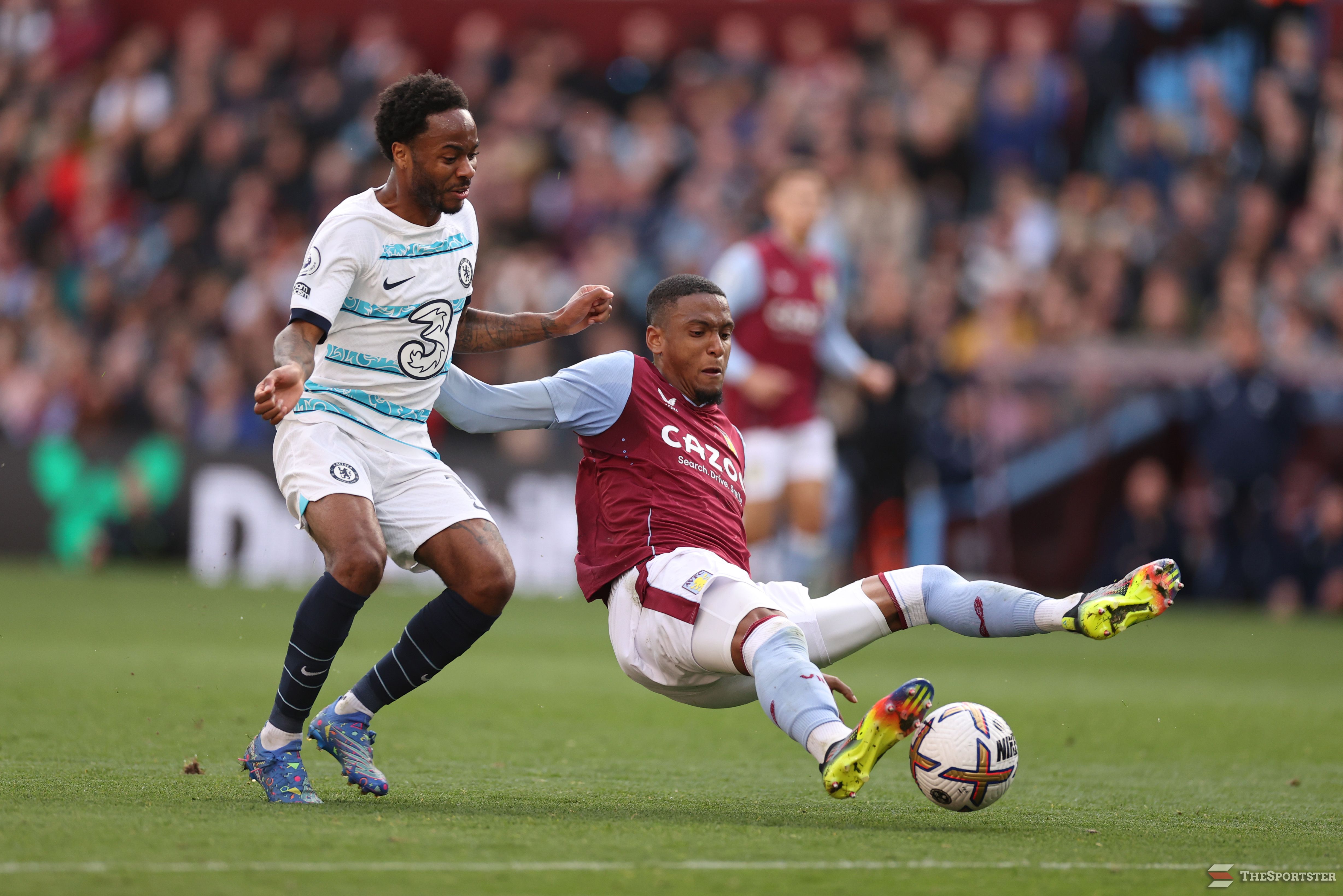 BIRMINGHAM, ENGLAND - OCTOBER 16: Raheem Sterling of Chelsea is challenged by Ezri Konsa of Aston Villa during the Premier League match between Aston Villa and Chelsea FC at Villa Park on October 16, 2022 in Birmingham, England. (Photo by Ryan Pierse/Getty Images)